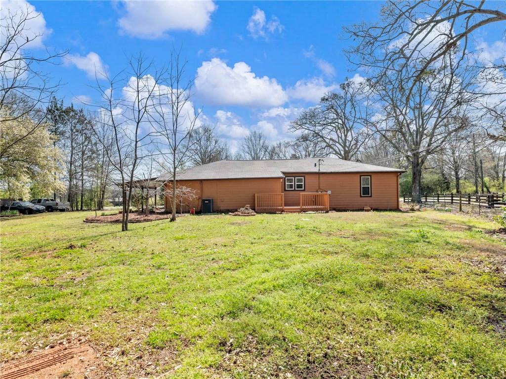1686 Shoal Creek Road Monroe, GA 30656 - Photo 42 of 50 a view of a house with a yard