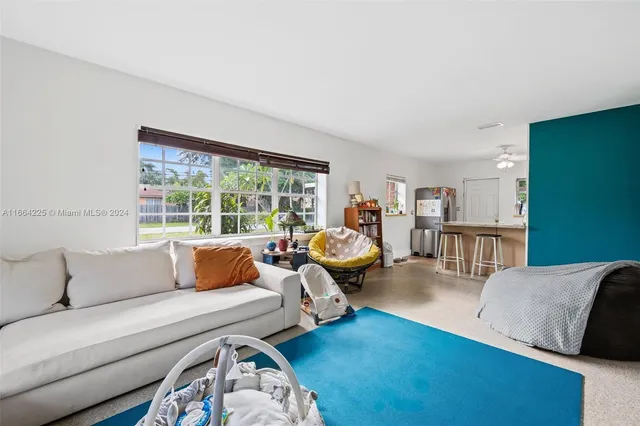 a bedroom with a bed and a book shelf