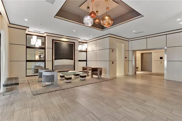 a very nice looking room with many windows and furniture