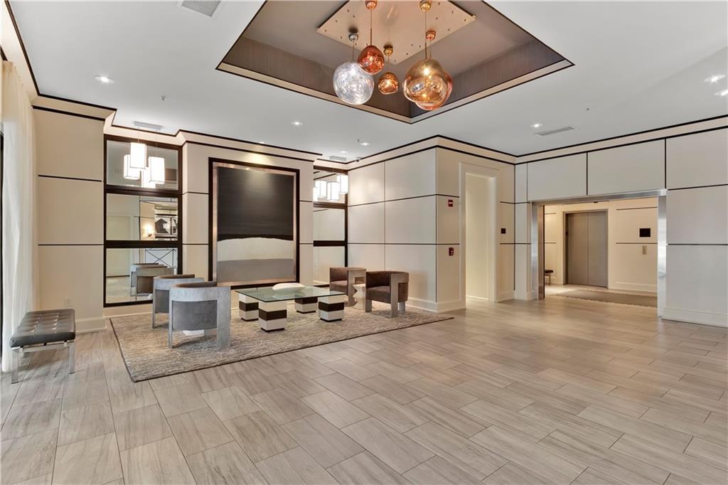 2828 Peachtree Road Northwest, Unit 1402 Atlanta, GA 30305 - Photo 13 of 23 a very nice looking room with many windows and furniture