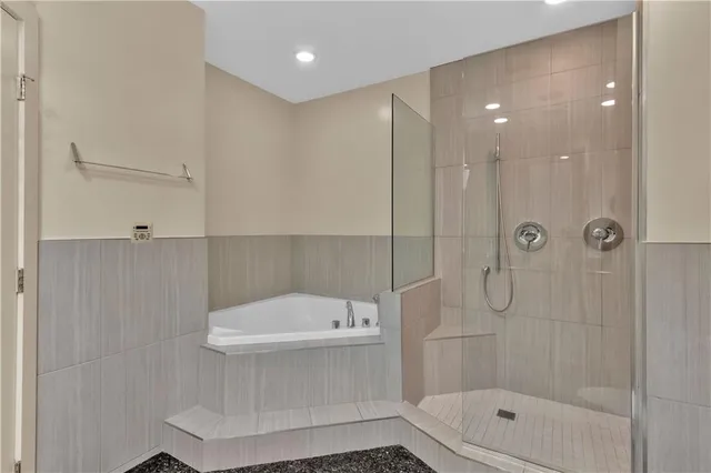 a bathroom with a shower a toilet and a shower