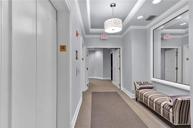 a view of a hallway with a chandelier