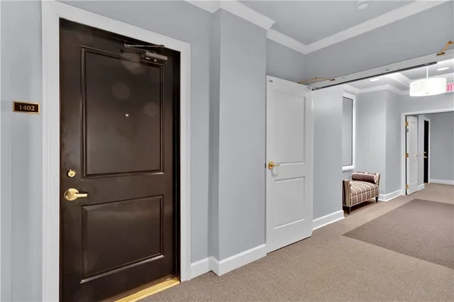 a view of a livingroom and a bathroom with mirror