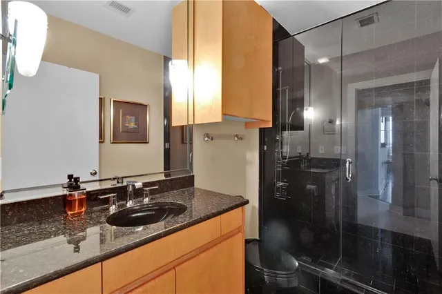 a bathroom with a sink and mirror