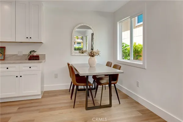 a view of a dining room with furniture and window
