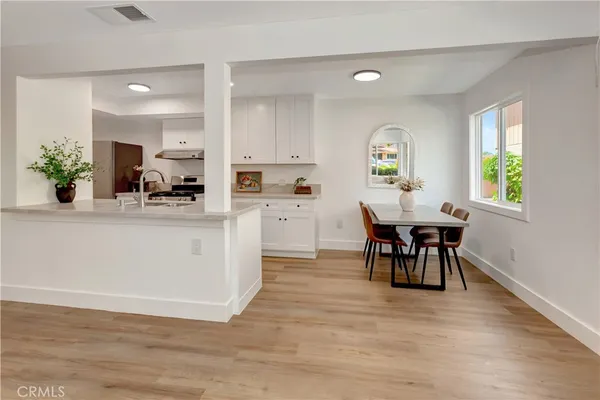 a view of kitchen with cabinets and wooden floor