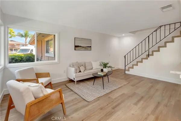 a living room with furniture and a table