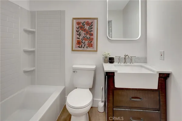 a bathroom with a sink toilet and bathtub