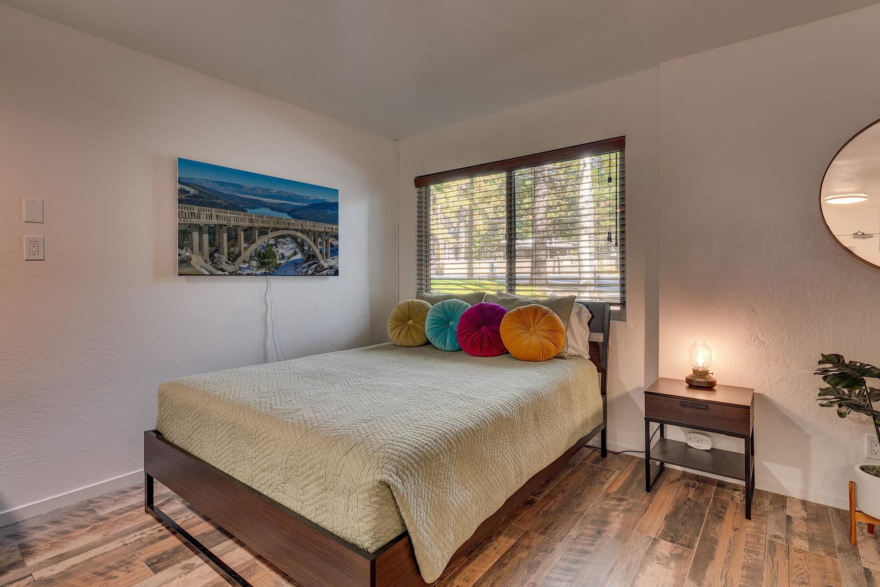 15775 Donner Pass Road, Unit 114 Truckee, CA 96161 - Photo 6 of 17 a bedroom with a bed and wooden floor