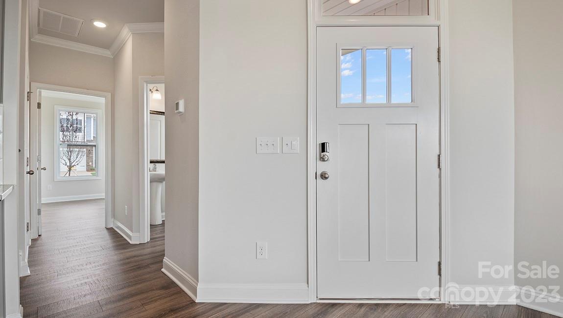 26 Ravens Rdg Road Hendersonville, NC 28792 - Photo 4 of 27 a view of a hallway with wooden floor