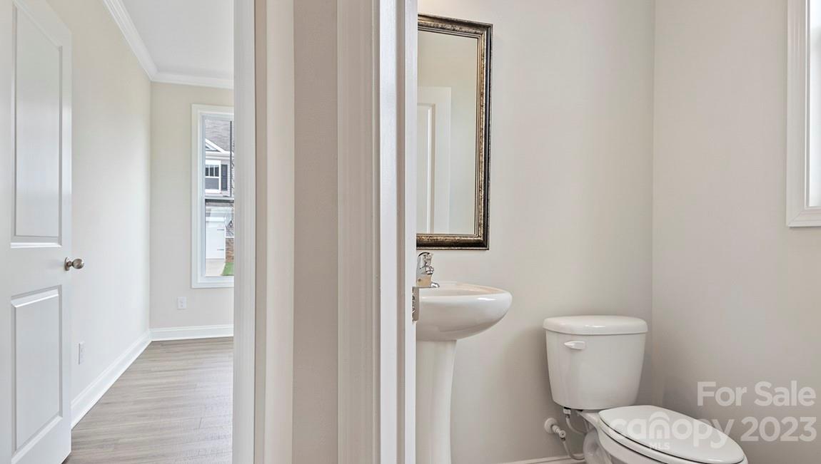 26 Ravens Rdg Road Hendersonville, NC 28792 - Photo 5 of 27 a white toilet sitting next to a bathroom sink