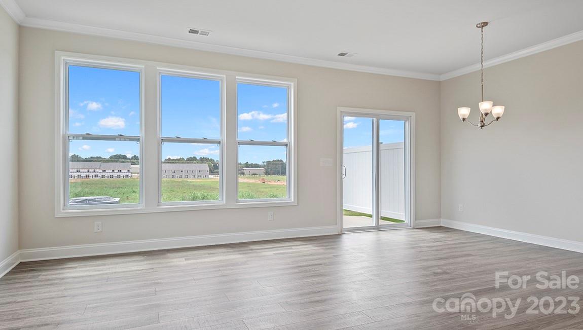 26 Ravens Rdg Road Hendersonville, NC 28792 - Photo 8 of 27 an empty room with wooden floor and windows