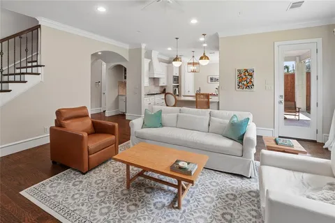 a living room with furniture and a rug