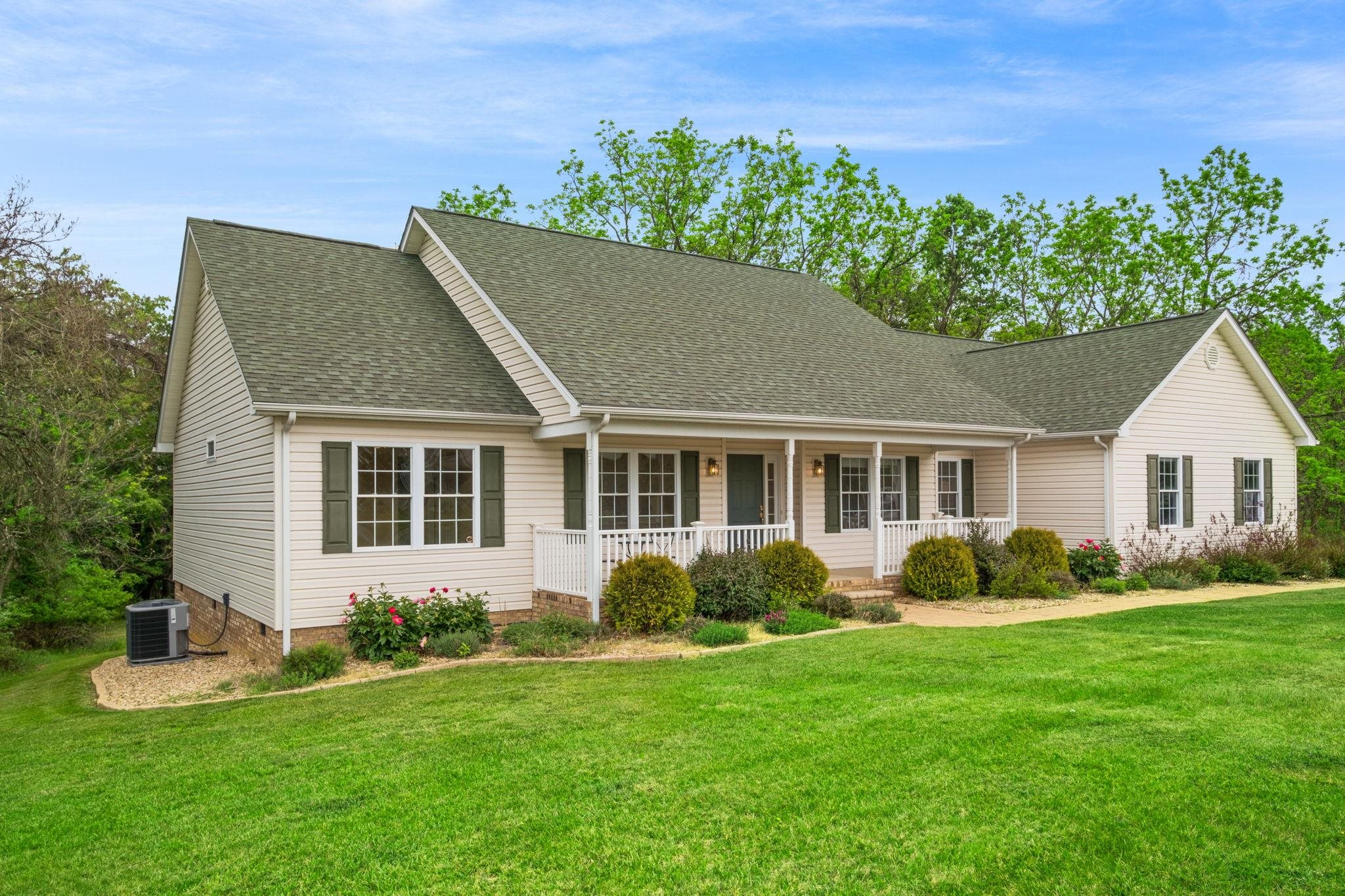 1456 New Hope Road Staunton, VA 24401 - Photo 1 of 46 a front view of a house with a garden