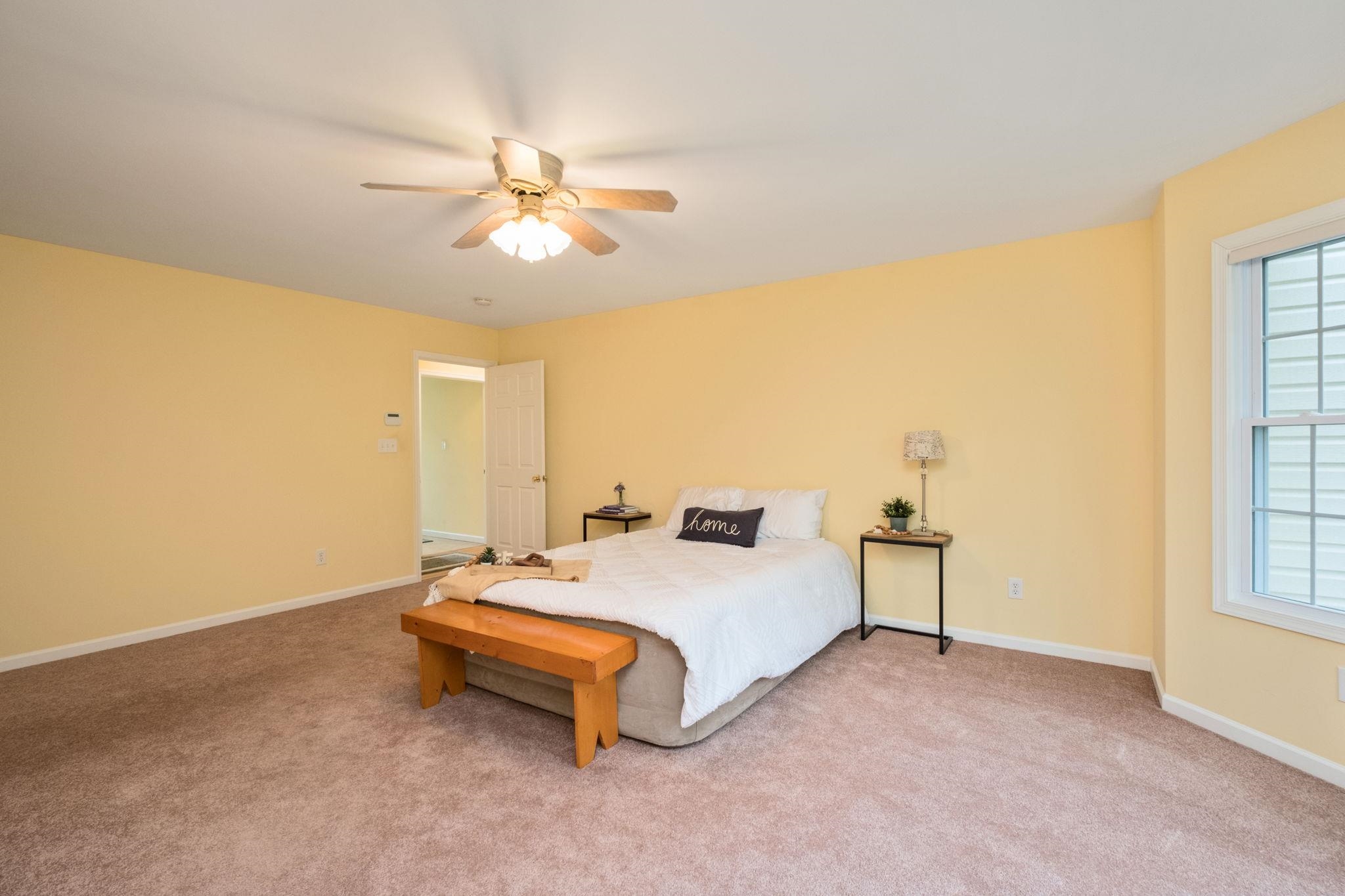 1456 New Hope Road Staunton, VA 24401 - Photo 12 of 46 a spacious bedroom with a bed and window