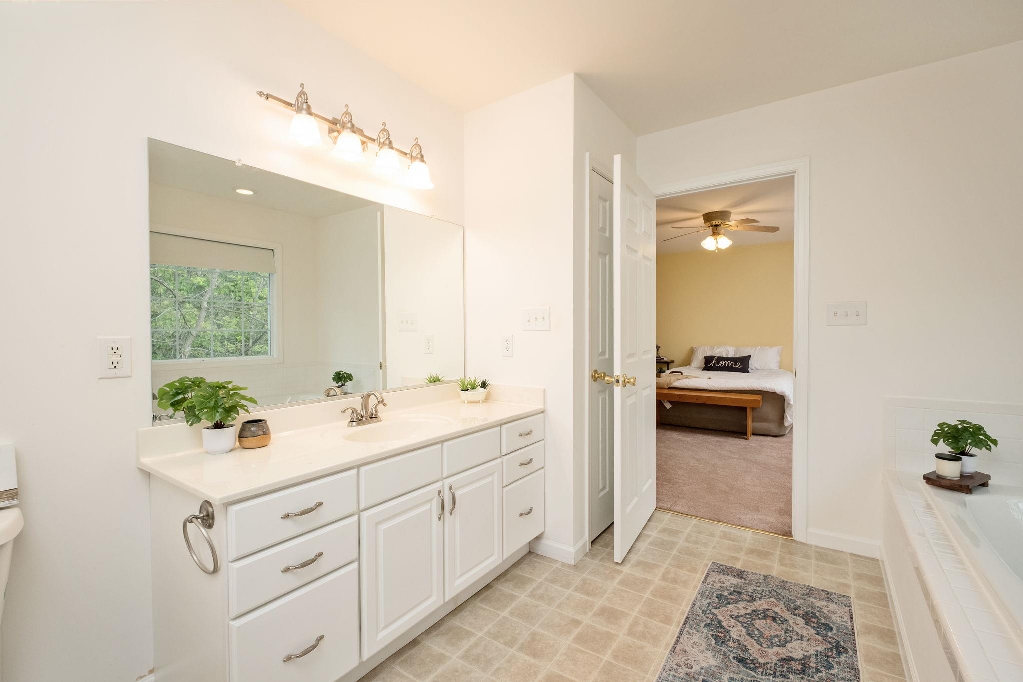 1456 New Hope Road Staunton, VA 24401 - Photo 16 of 46 a spacious bathroom with a double vanity sink a mirror and a shower