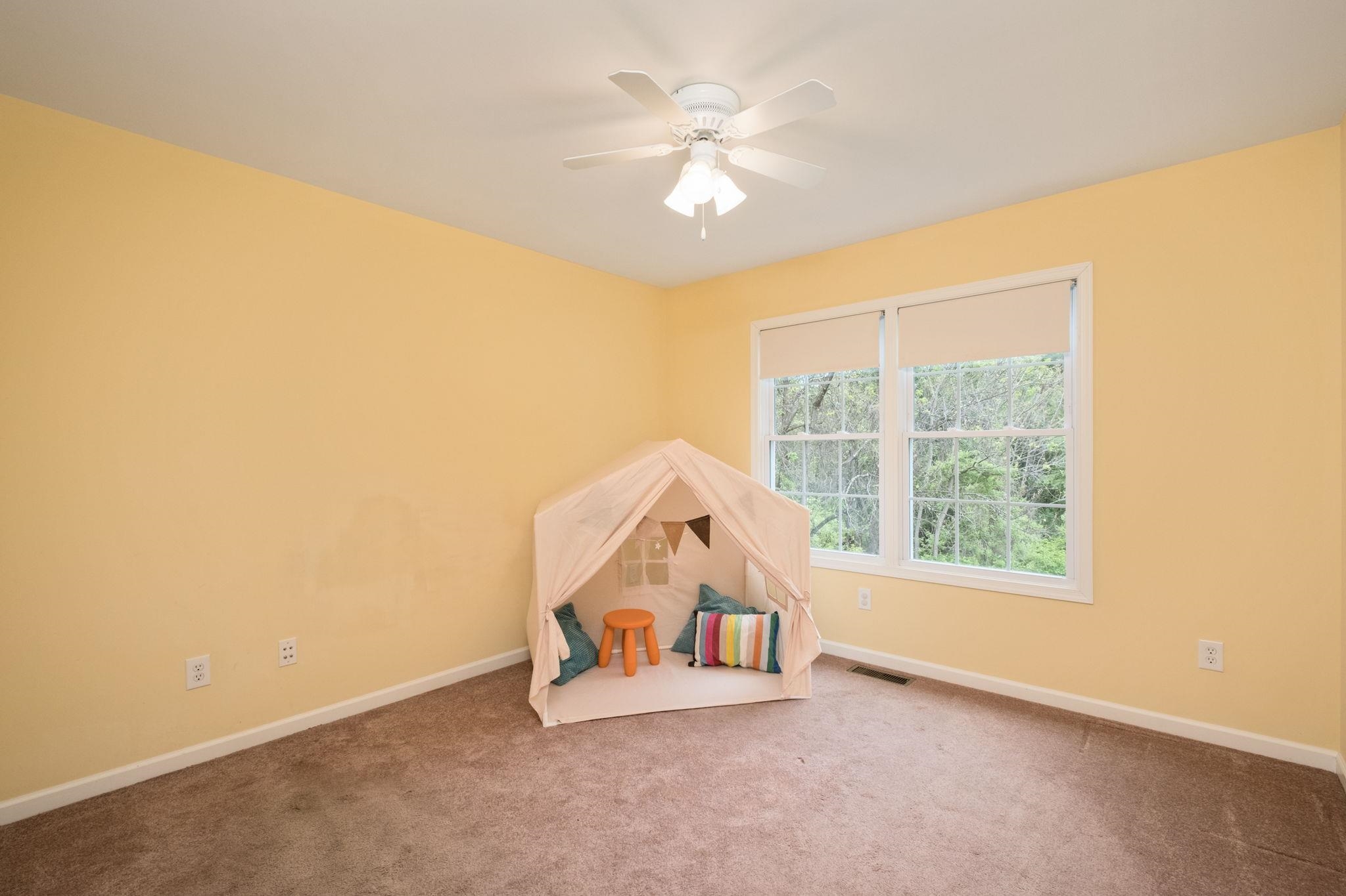 1456 New Hope Road Staunton, VA 24401 - Photo 18 of 46 an empty room with windows and ceiling fan