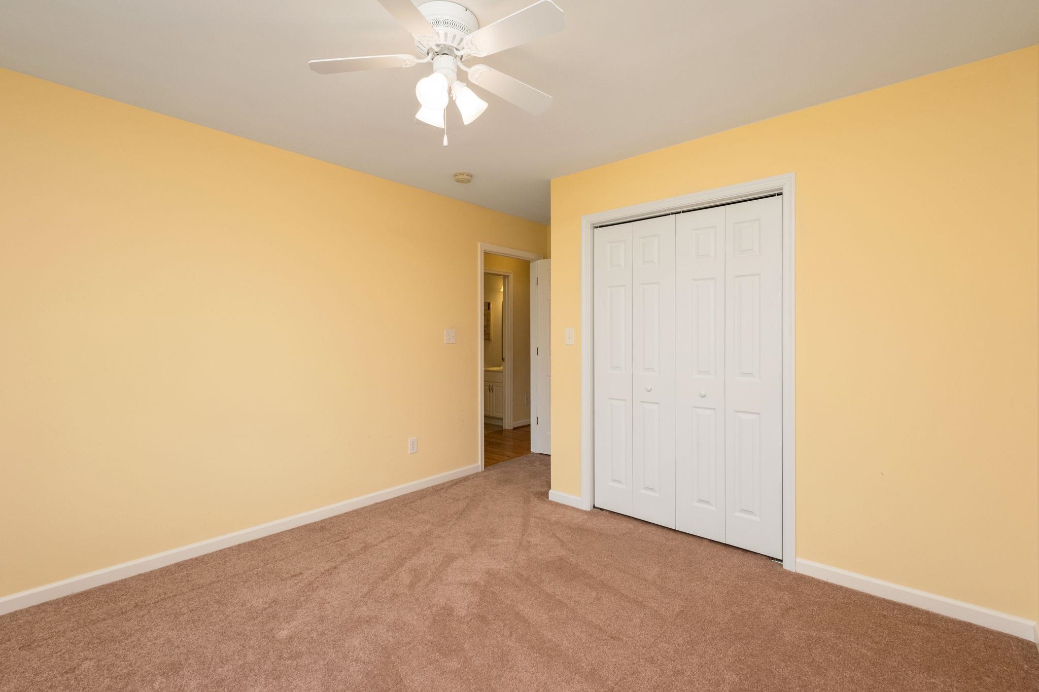 1456 New Hope Road Staunton, VA 24401 - Photo 22 of 46 an empty room with a ceiling fan and a window