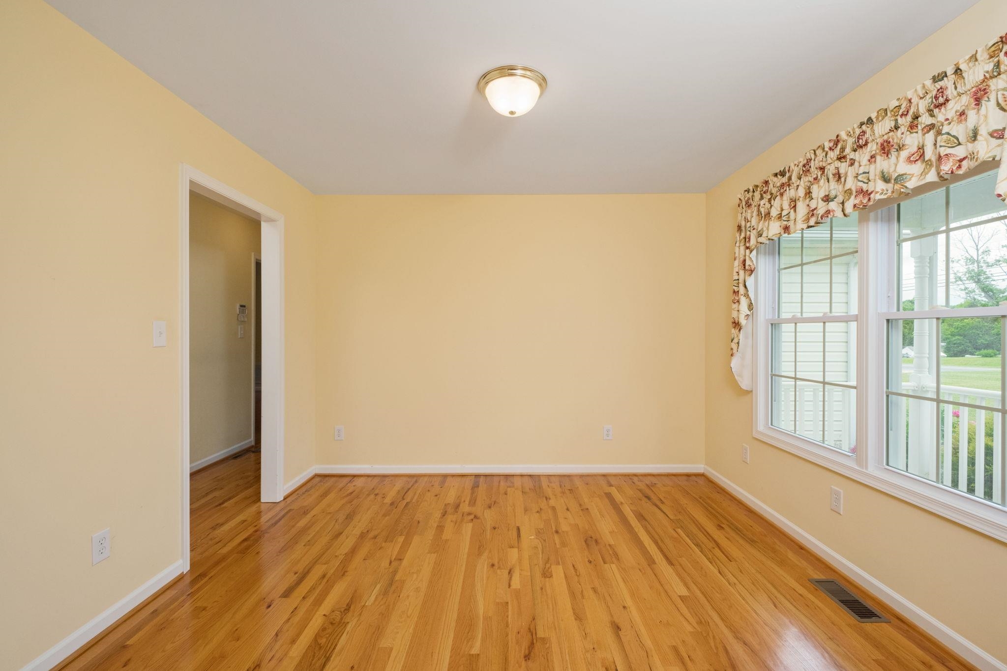 1456 New Hope Road Staunton, VA 24401 - Photo 23 of 46 an empty room with wooden floor and windows