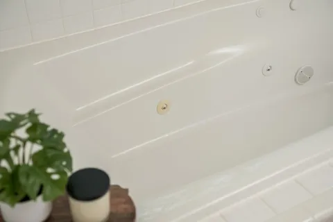 a bathroom with a sink and mirror