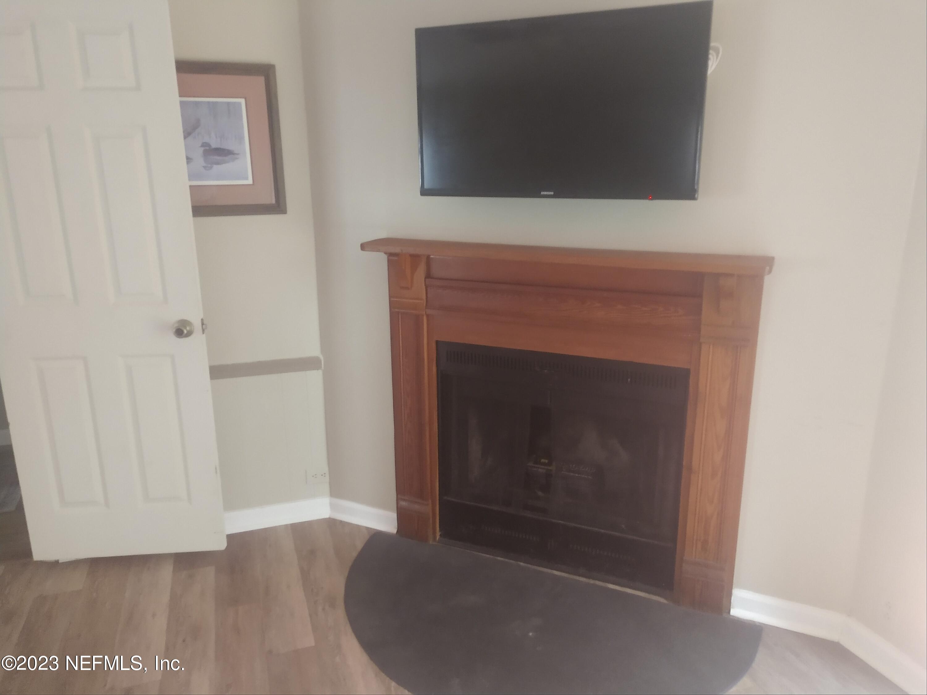 54632 Marsh Road Callahan, FL 32011 - Photo 16 of 32 a living room with a fireplace