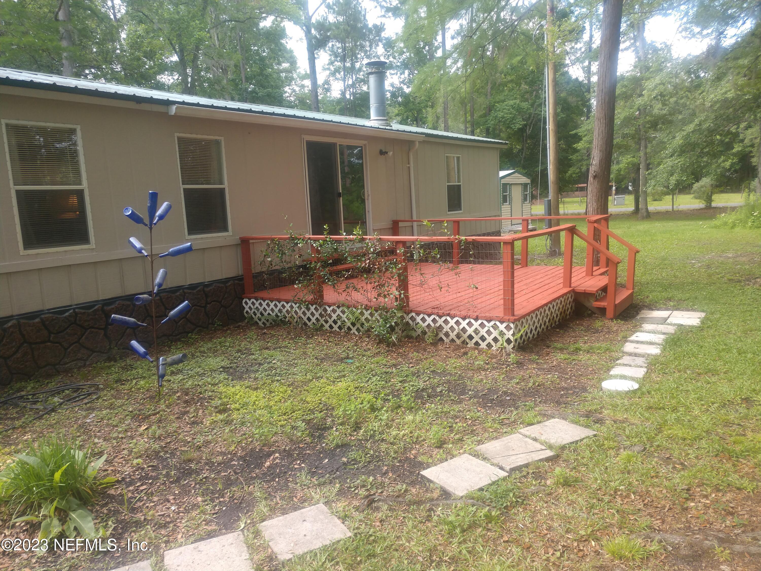 54632 Marsh Road Callahan, FL 32011 - Photo 4 of 32 a front view of a house with garden