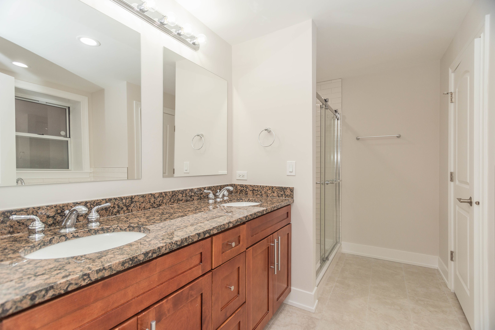 5444 North Winthrop Avenue, Unit GS Chicago, IL 60640 - Photo 12 of 18 a bathroom with a granite countertop sink and a mirror