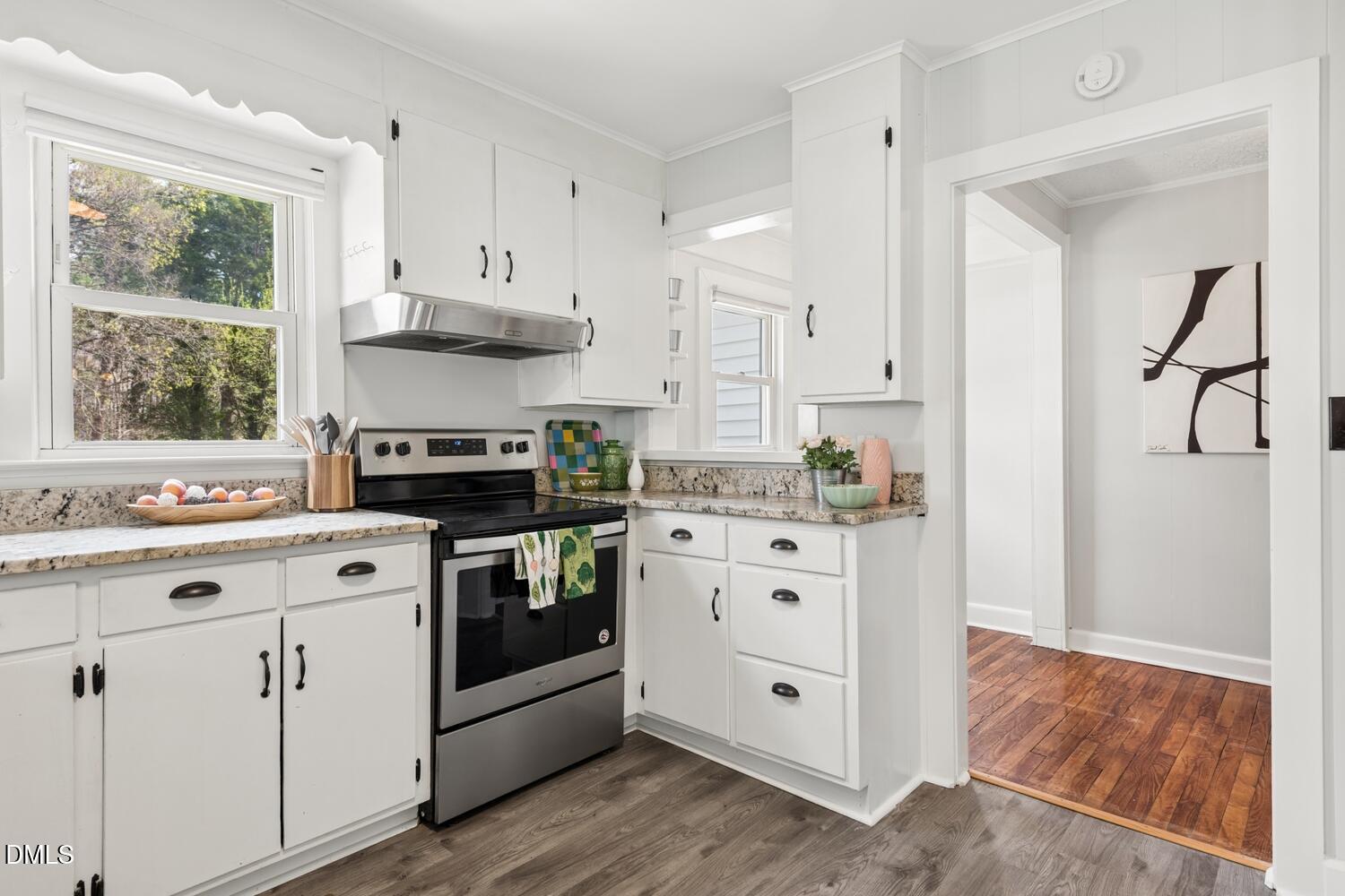 414 South Maple Street Graham, NC 27253 - Photo 10 of 42 a kitchen with white cabinets and white appliances