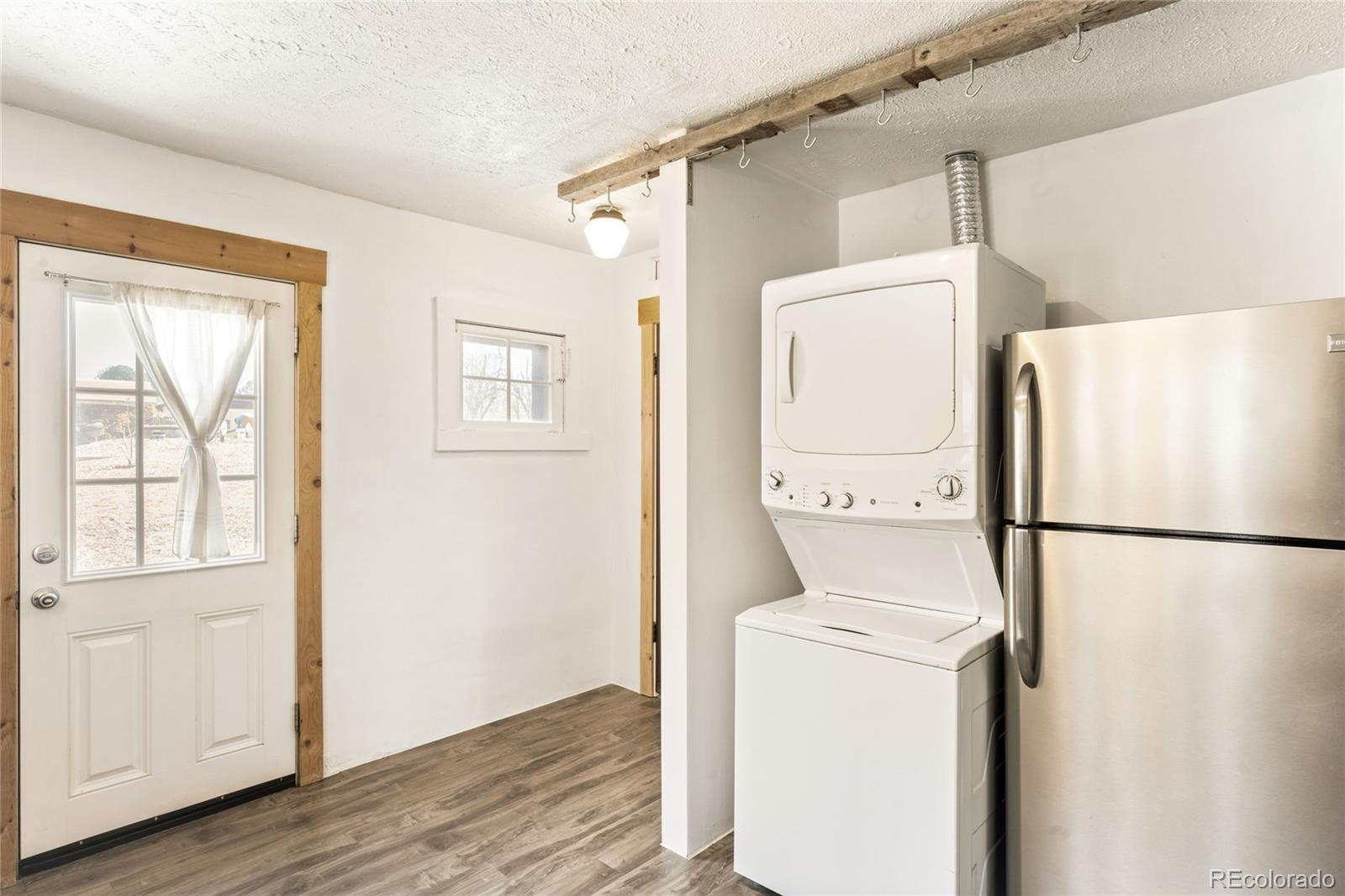 6800 Monaco Street Commerce City, CO 80022 - Photo 12 of 29 a utility room with dryer and washer