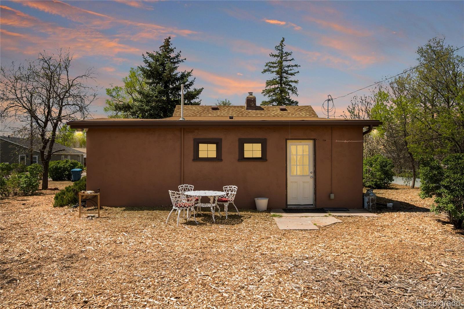 6800 Monaco Street Commerce City, CO 80022 - Photo 19 of 29 a front view of a house with a yard