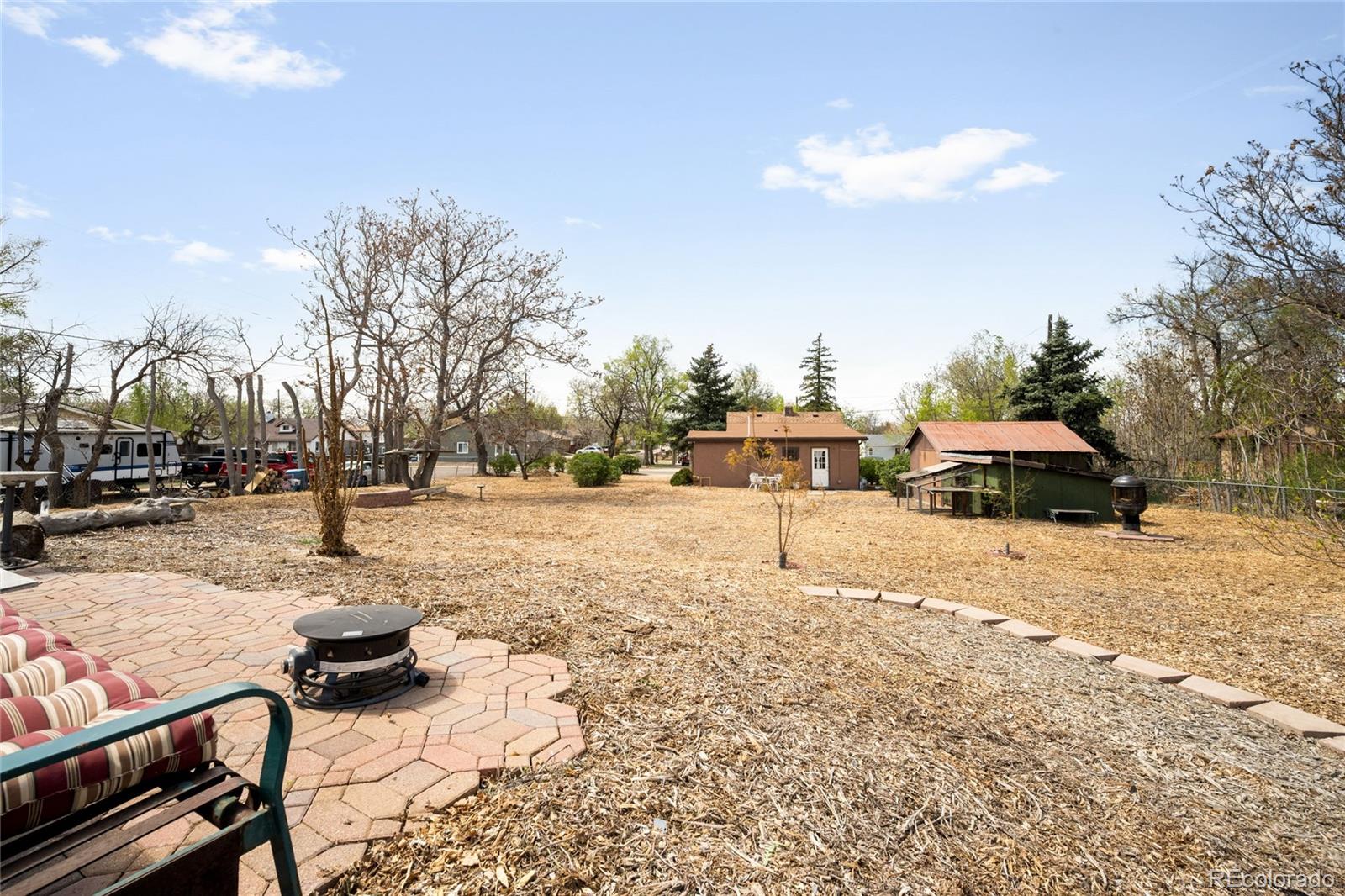 6800 Monaco Street Commerce City, CO 80022 - Photo 20 of 29 a street view with residential house