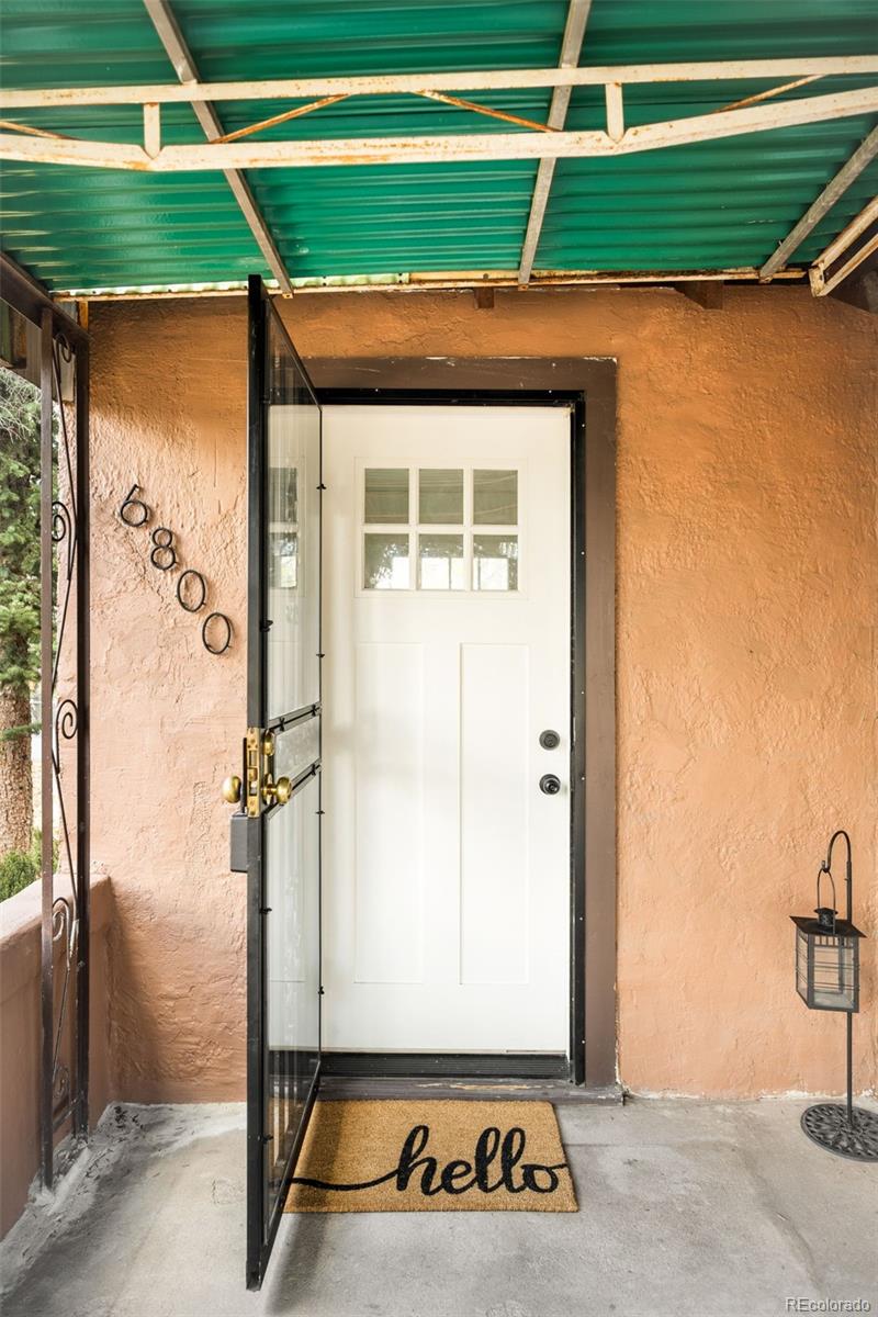 6800 Monaco Street Commerce City, CO 80022 - Photo 2 of 29 a front door view of a house