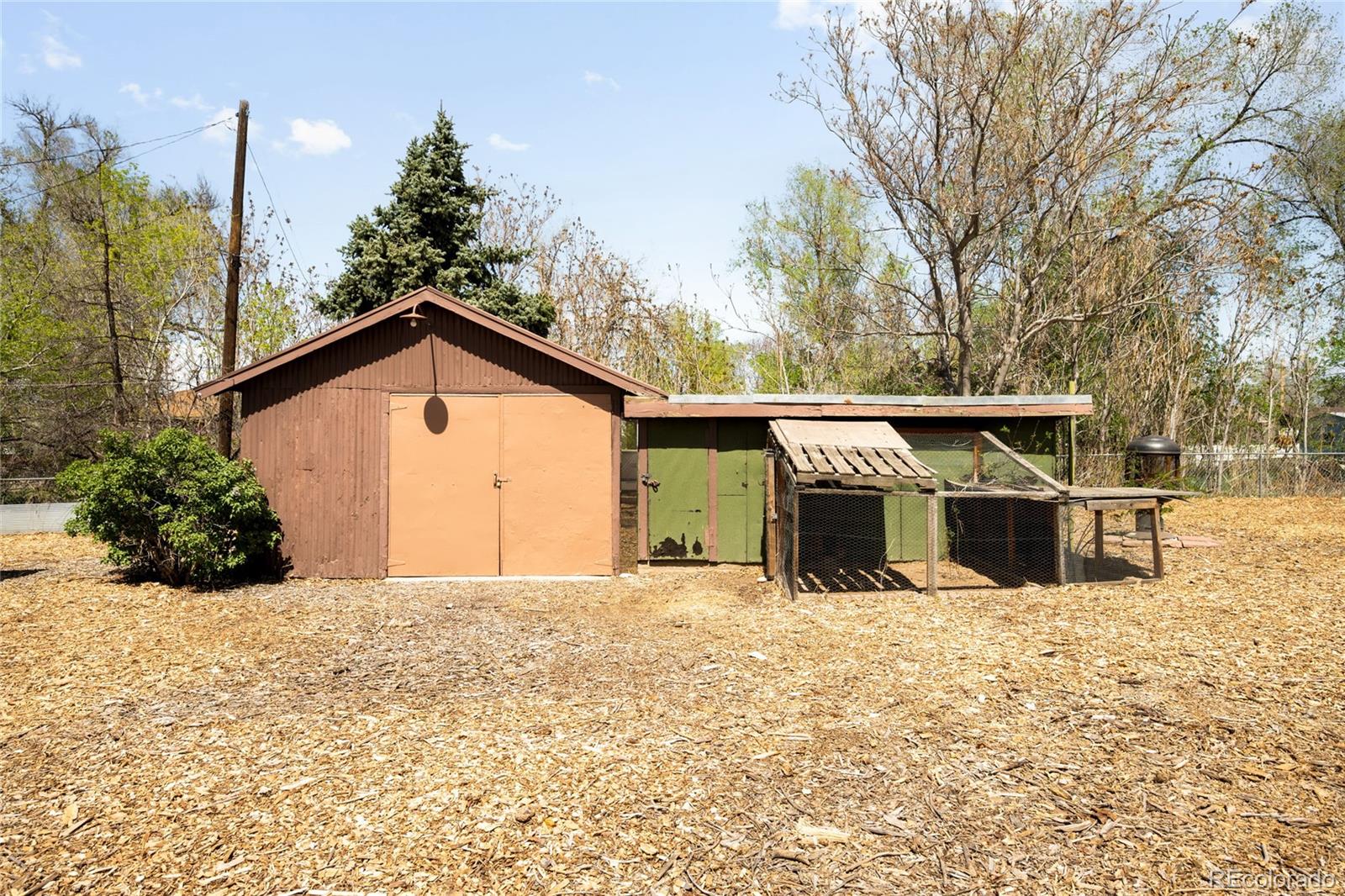 6800 Monaco Street Commerce City, CO 80022 - Photo 21 of 29 a view of a house with a snow in the yard