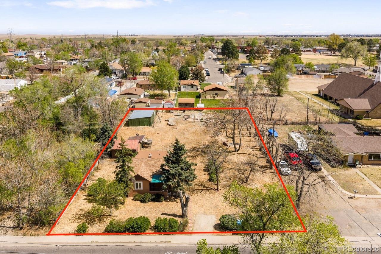 6800 Monaco Street Commerce City, CO 80022 - Photo 24 of 29 an aerial view of residential houses with outdoor space