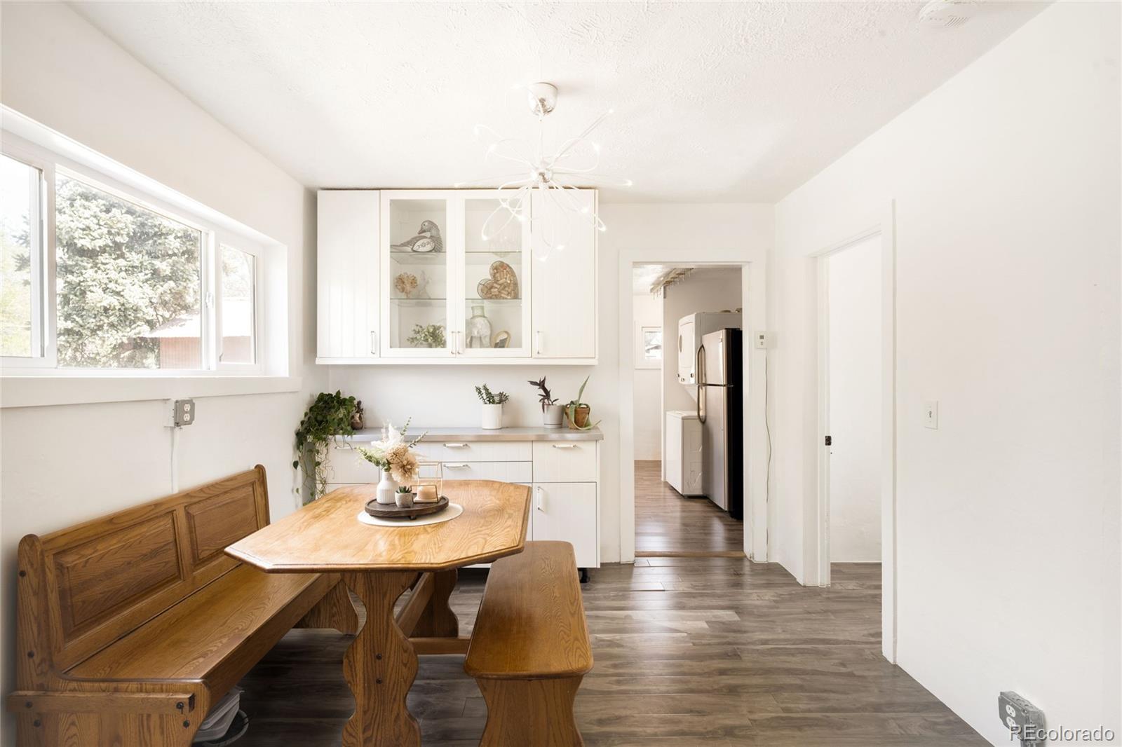 6800 Monaco Street Commerce City, CO 80022 - Photo 6 of 29 a view of a dining room with furniture and window