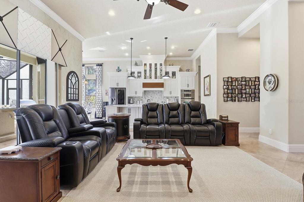 1416 North Ridge Meadow Path Hernando, FL 34442 - Photo 12 of 68 a living room with furniture kitchen view and a chandelier