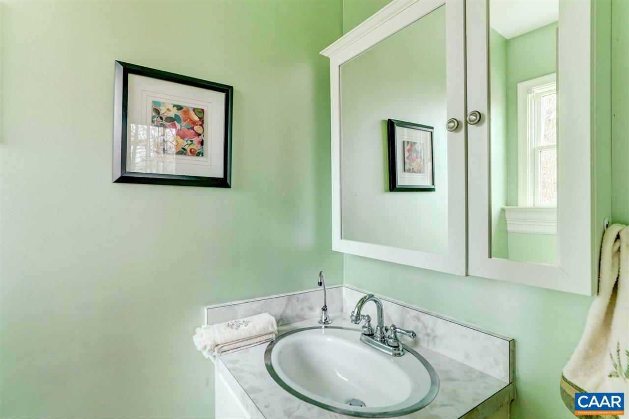 2295 Whippoorwill Road Charlottesville, VA 22901 - Photo 19 of 49 a bathroom with a sink and a mirror