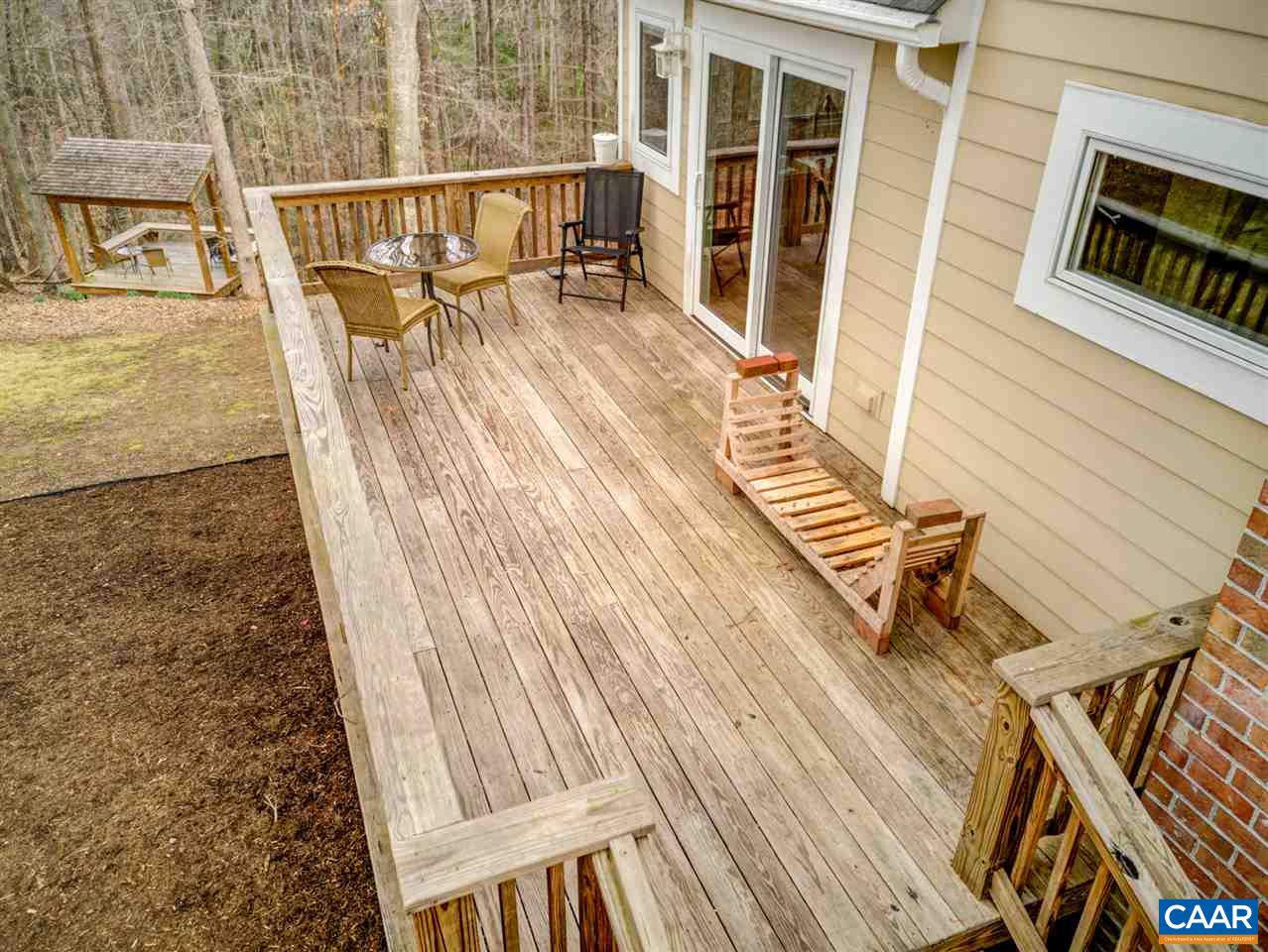 2295 Whippoorwill Road Charlottesville, VA 22901 - Photo 44 of 49 a view of balcony with wooden floor and outdoor seating