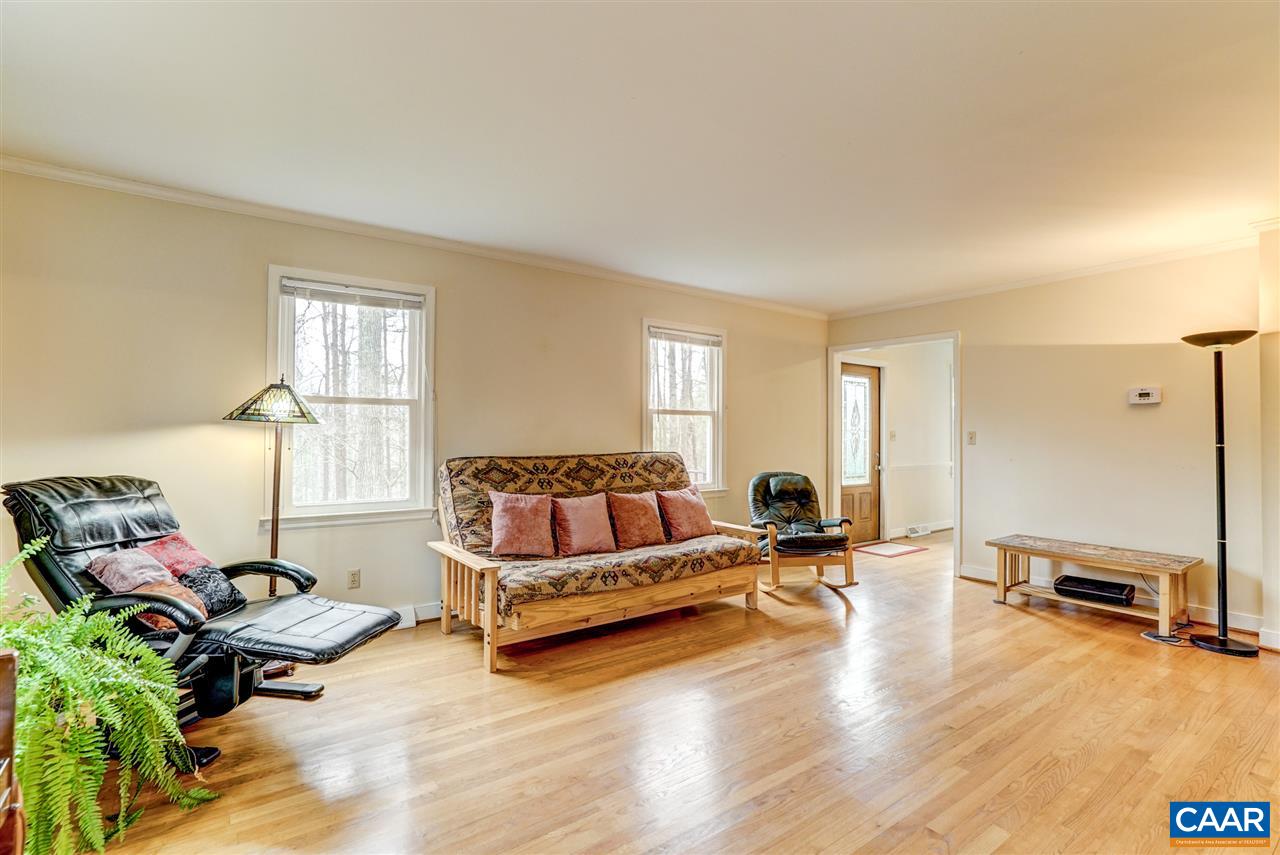 2295 Whippoorwill Road Charlottesville, VA 22901 - Photo 6 of 49 a living room with furniture window and a table
