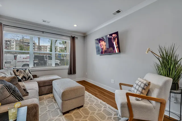 a living room with furniture and a large window