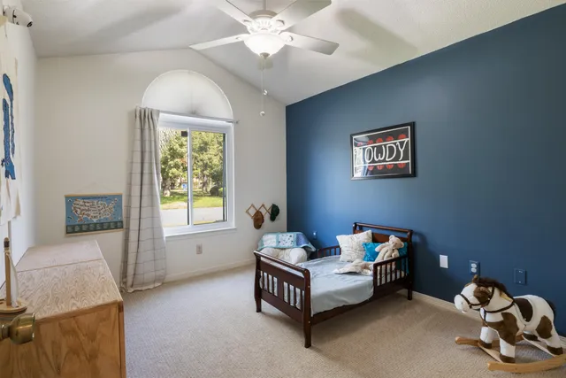 a bathroom with a sink a toilet and a window