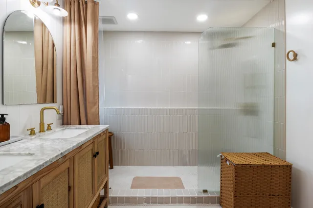 a bathroom with a toilet a sink and window