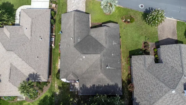 an aerial view of residential house with outdoor space and lake view