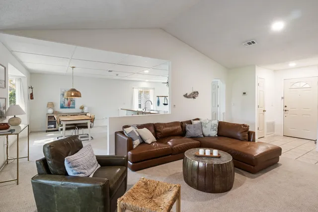 a living room with furniture and a couch