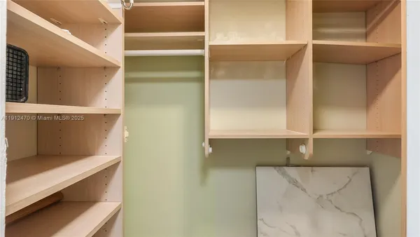 a bathroom with a sink toilet vanity and shower