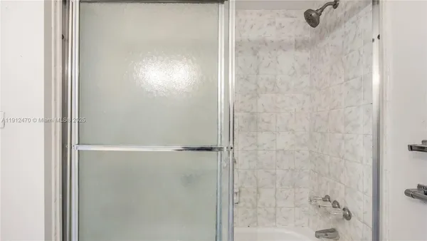 a bathroom with a toilet and a mirror