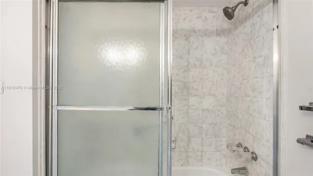a bathroom with a toilet and a mirror