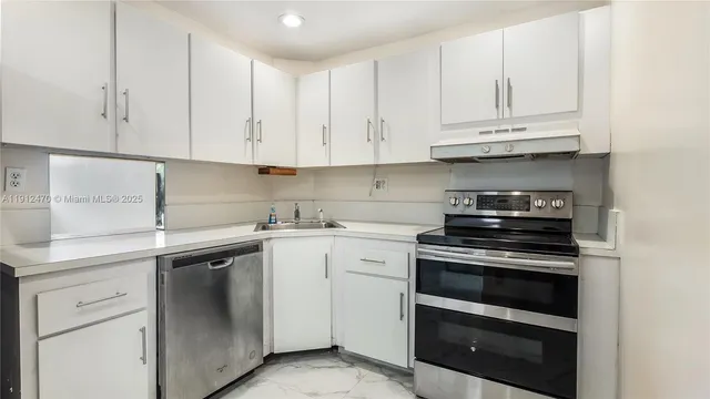 a white refrigerator freezer sitting inside of a kitchen