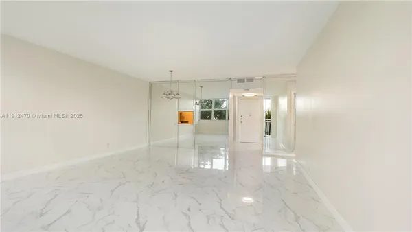 a view of a room with a large window in it