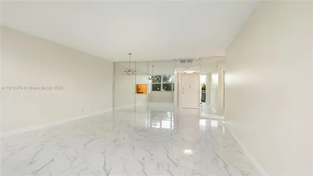 a view of a room with a large window in it